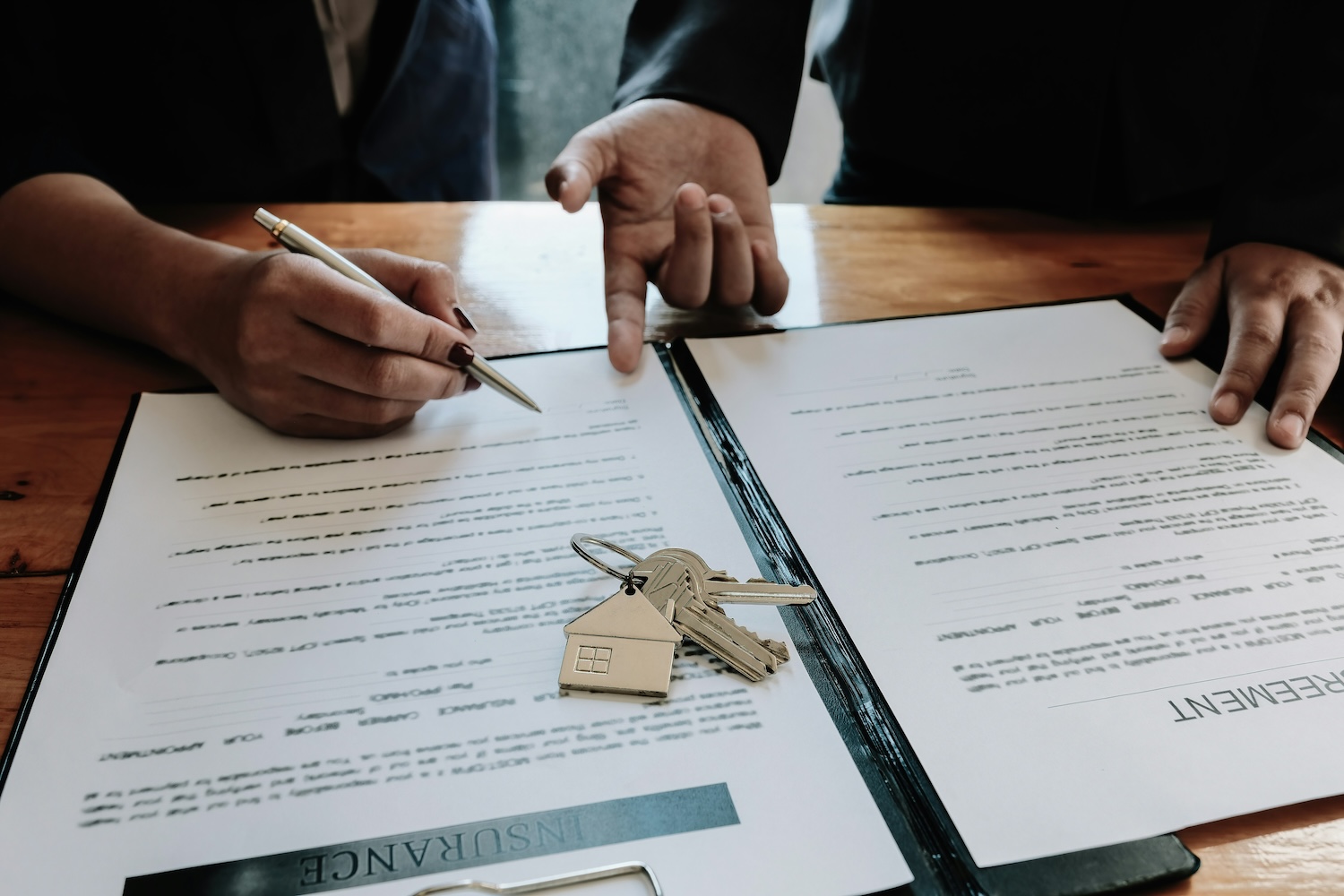 agreement on a table with two hands